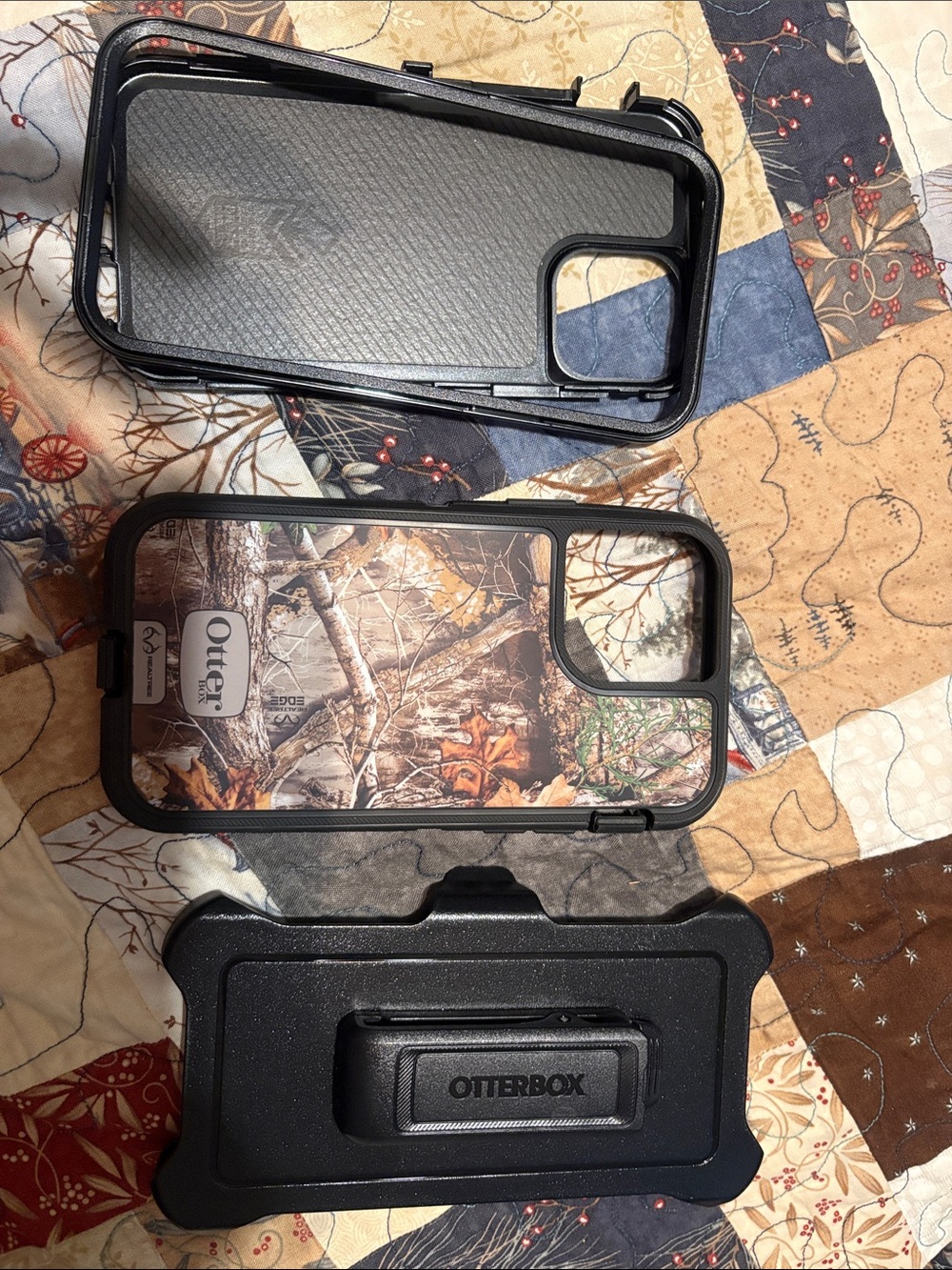 Otter box iPhone 12 case plastic and silicone outer layer and holster in camo
